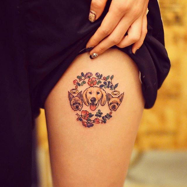 tatuagem feminina de animais na coxa